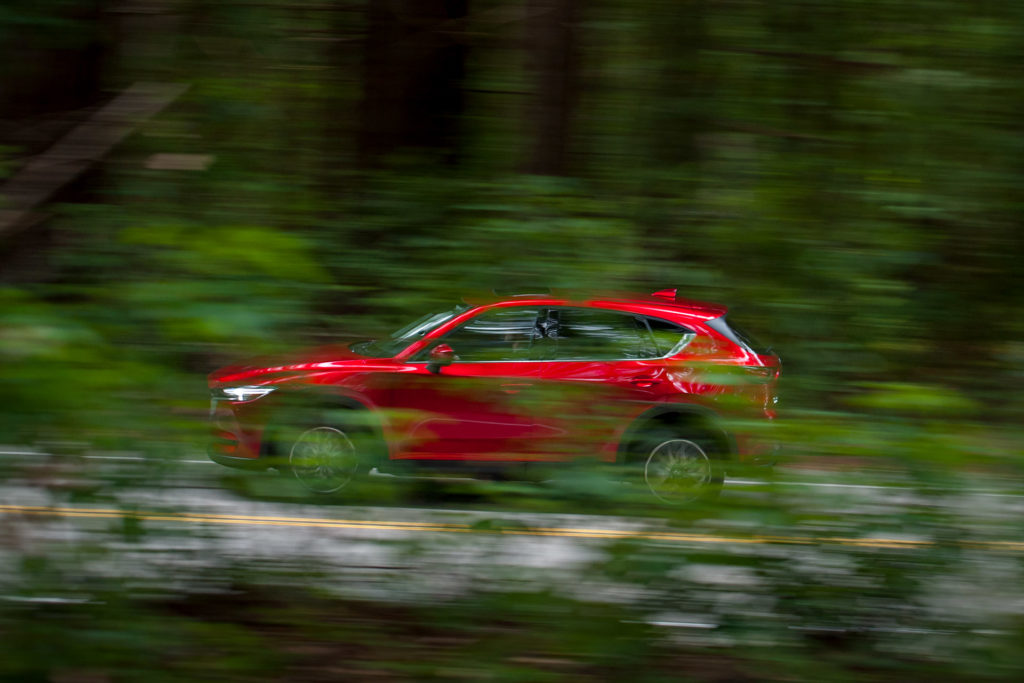 Soul Red 2018 Mazda CX-5 SKYACTIV driving through the woods automotive photography
