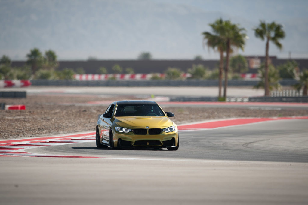 F82 F84 gold BMW M4 competing in European Car magazine Tuner GP at Thermal Club automotive photography