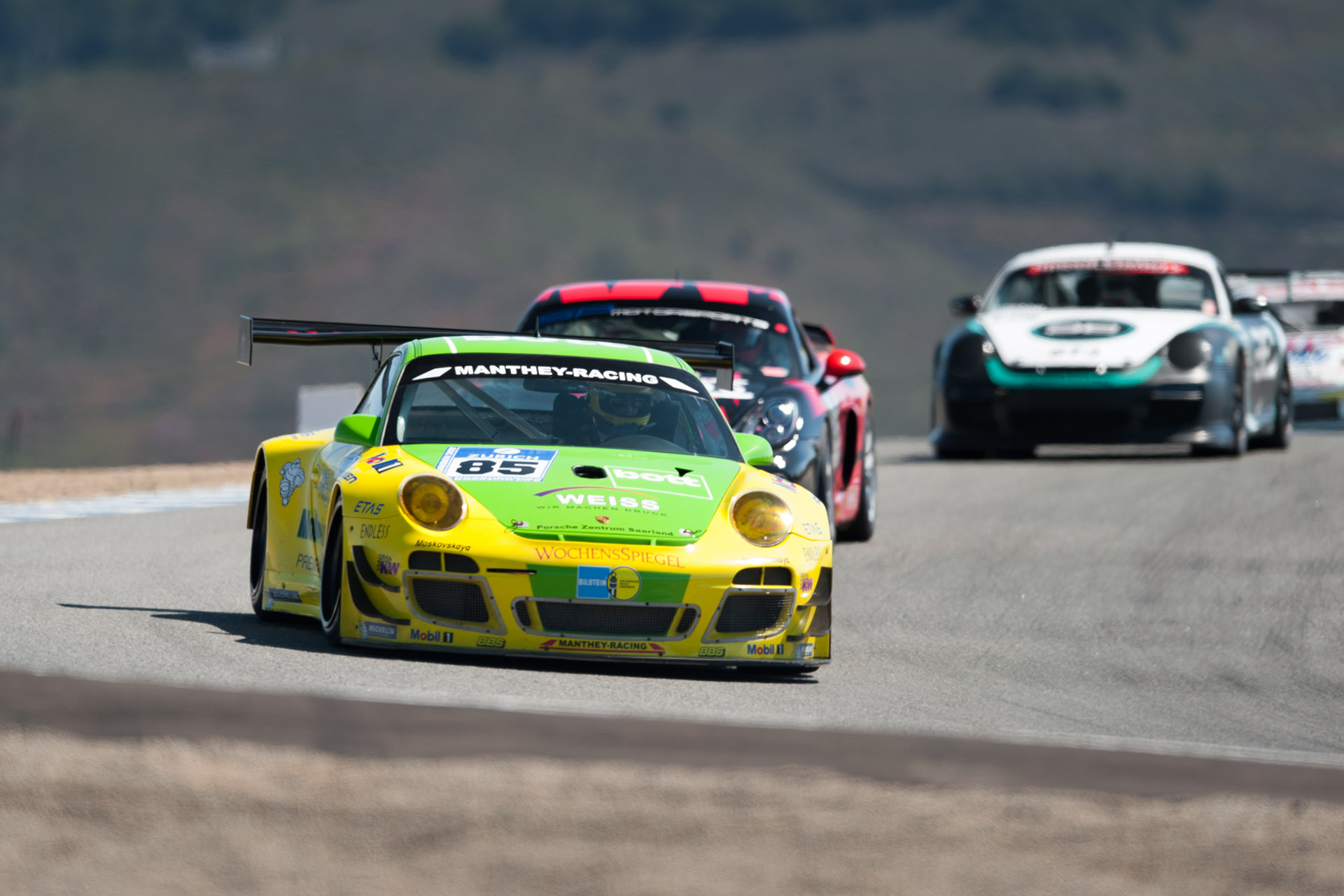 yellow and green luke Munnell motorsports photography Porsche 911 GT3 RSR, Manthey Racing Weiss 85 racing at Laguna Seca in California