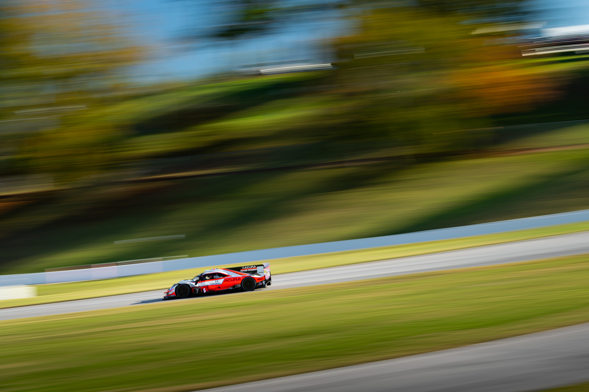 Helio Castroneves and the Acura Team Penske ARX-05 DPi, at IMSA Petit Le Mans at Road Atlanta, motorsports photography by Luke Munnell